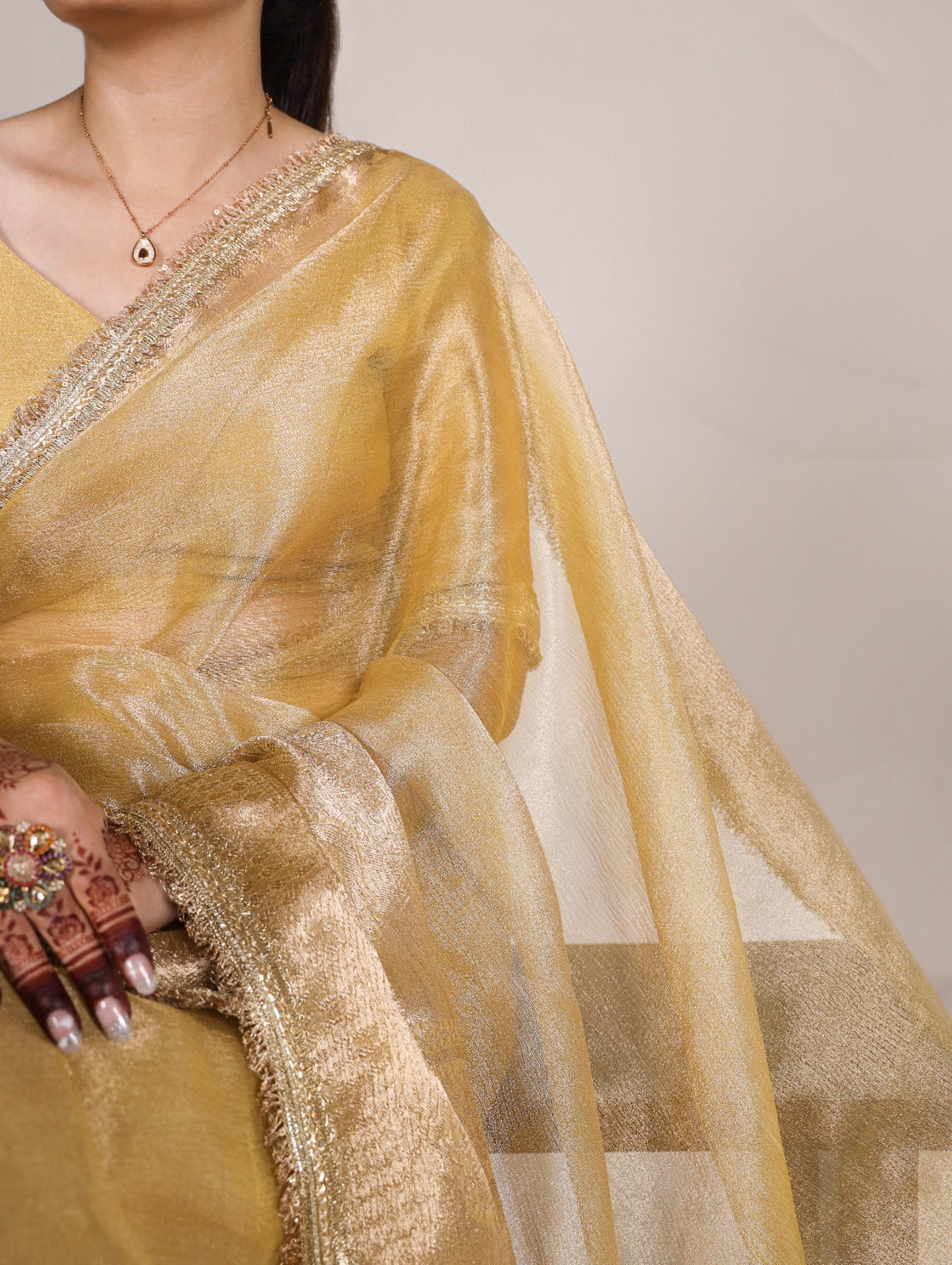 Golden Glow Tissue Shimmer Saree with Zari Weaving & Sequins Lace Border