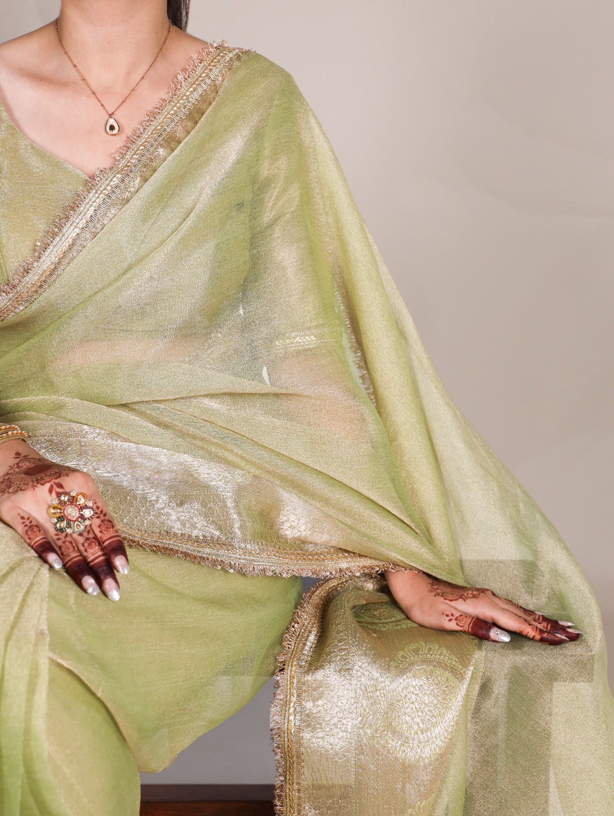Golden Glow Tissue Shimmer Saree with Zari Weaving & Sequins Lace Border