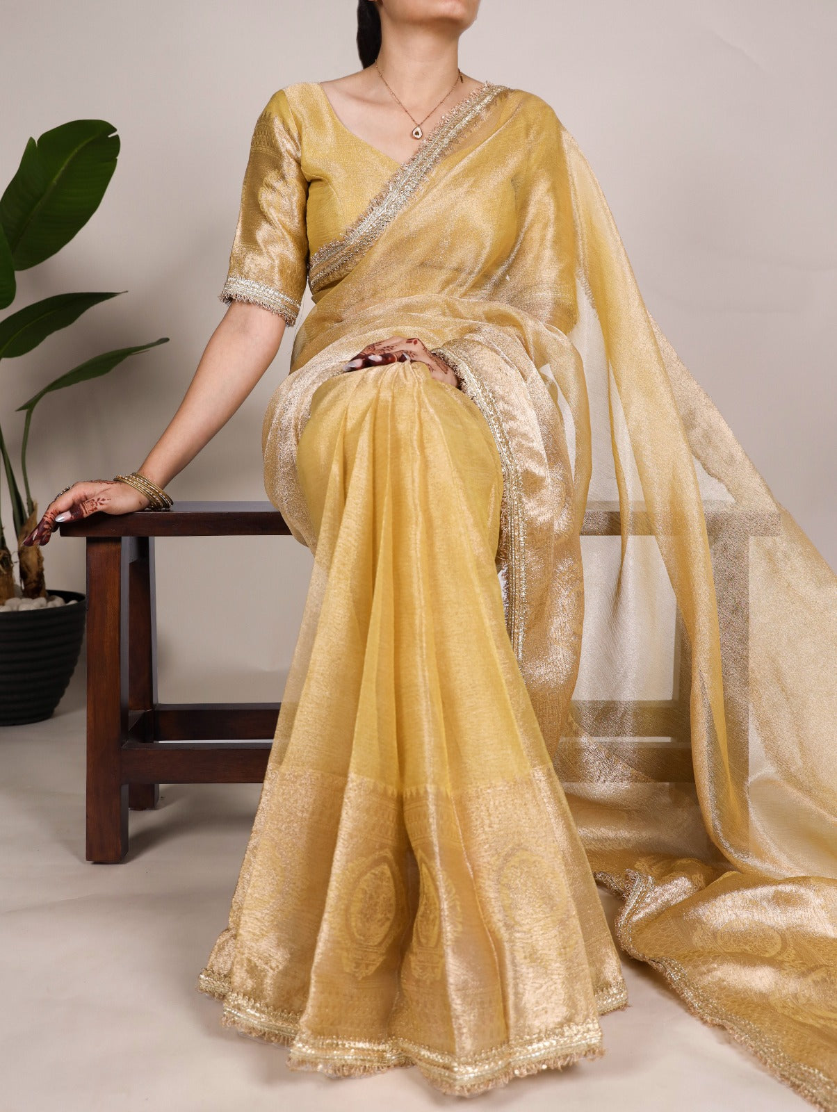 Golden Glow Tissue Shimmer Saree with Zari Weaving & Sequins Lace Border