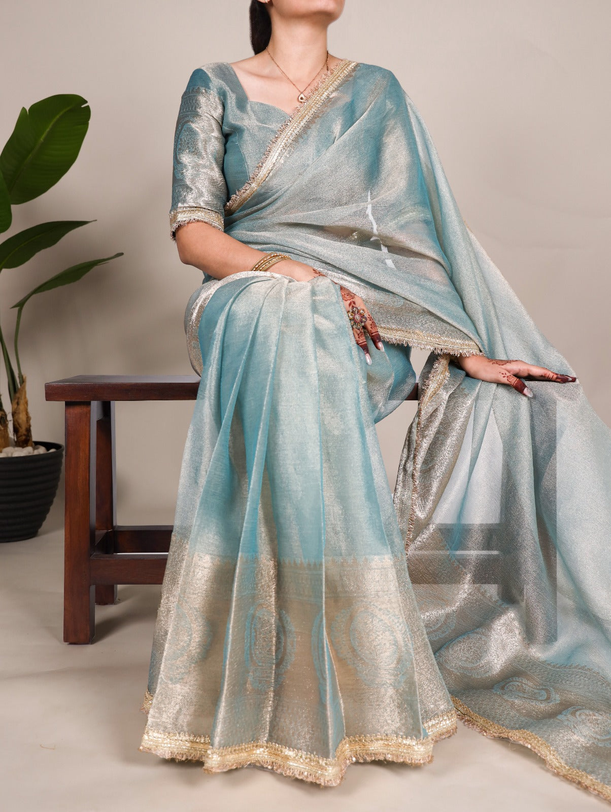 Golden Glow Tissue Shimmer Saree with Zari Weaving & Sequins Lace Border