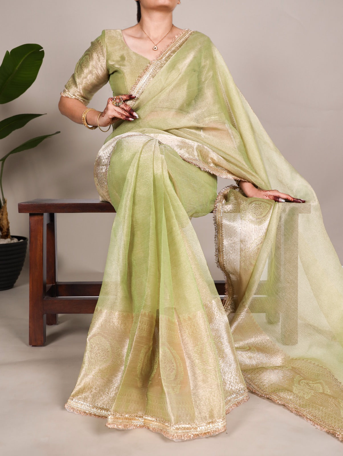 Golden Glow Tissue Shimmer Saree with Zari Weaving & Sequins Lace Border