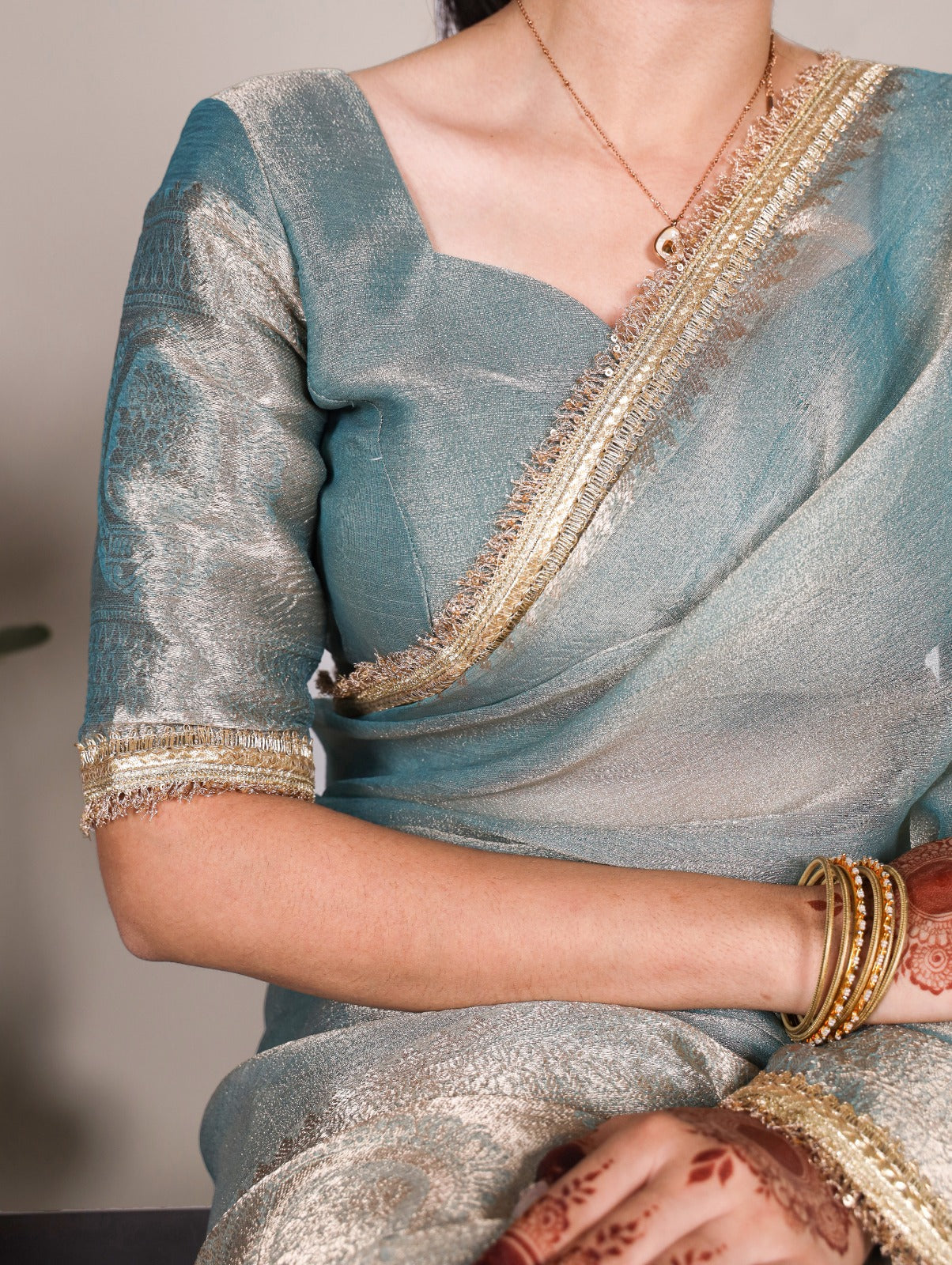 Golden Glow Tissue Shimmer Saree with Zari Weaving & Sequins Lace Border