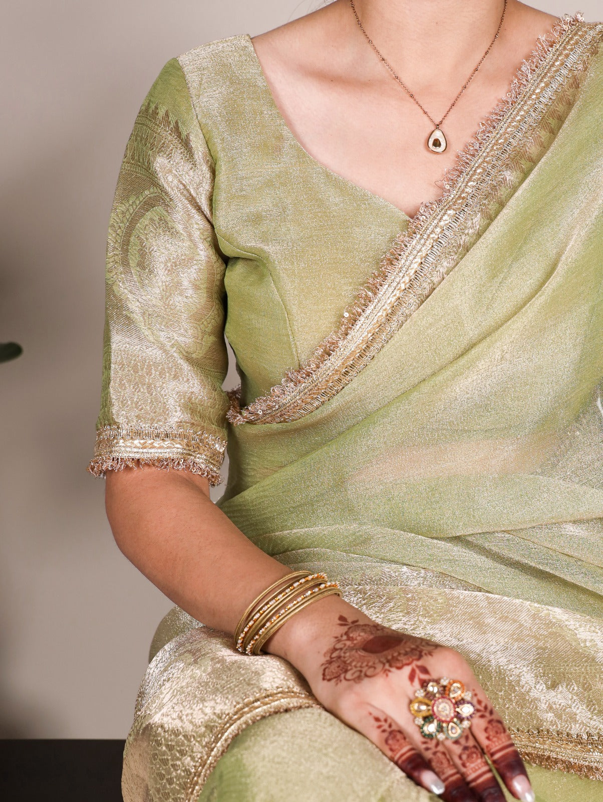 Golden Glow Tissue Shimmer Saree with Zari Weaving & Sequins Lace Border